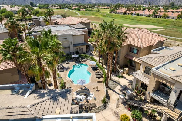 an aerial view of a house with a swimming pool yard and outdoor seating