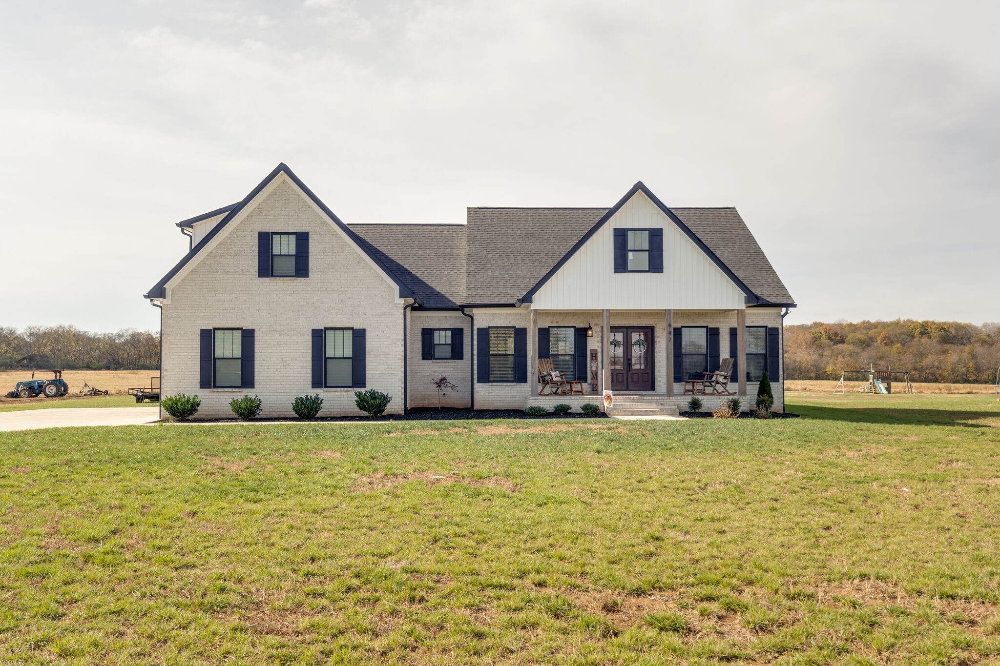 a house with a large pool in front of it