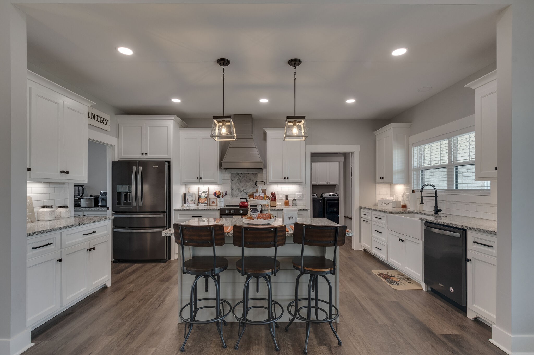 947 South Cross Bridges Road Mount Pleasant, TN 38474 - Photo 13 of 37 a kitchen with stainless steel appliances kitchen island granite countertop a dining table chairs and refrigerator