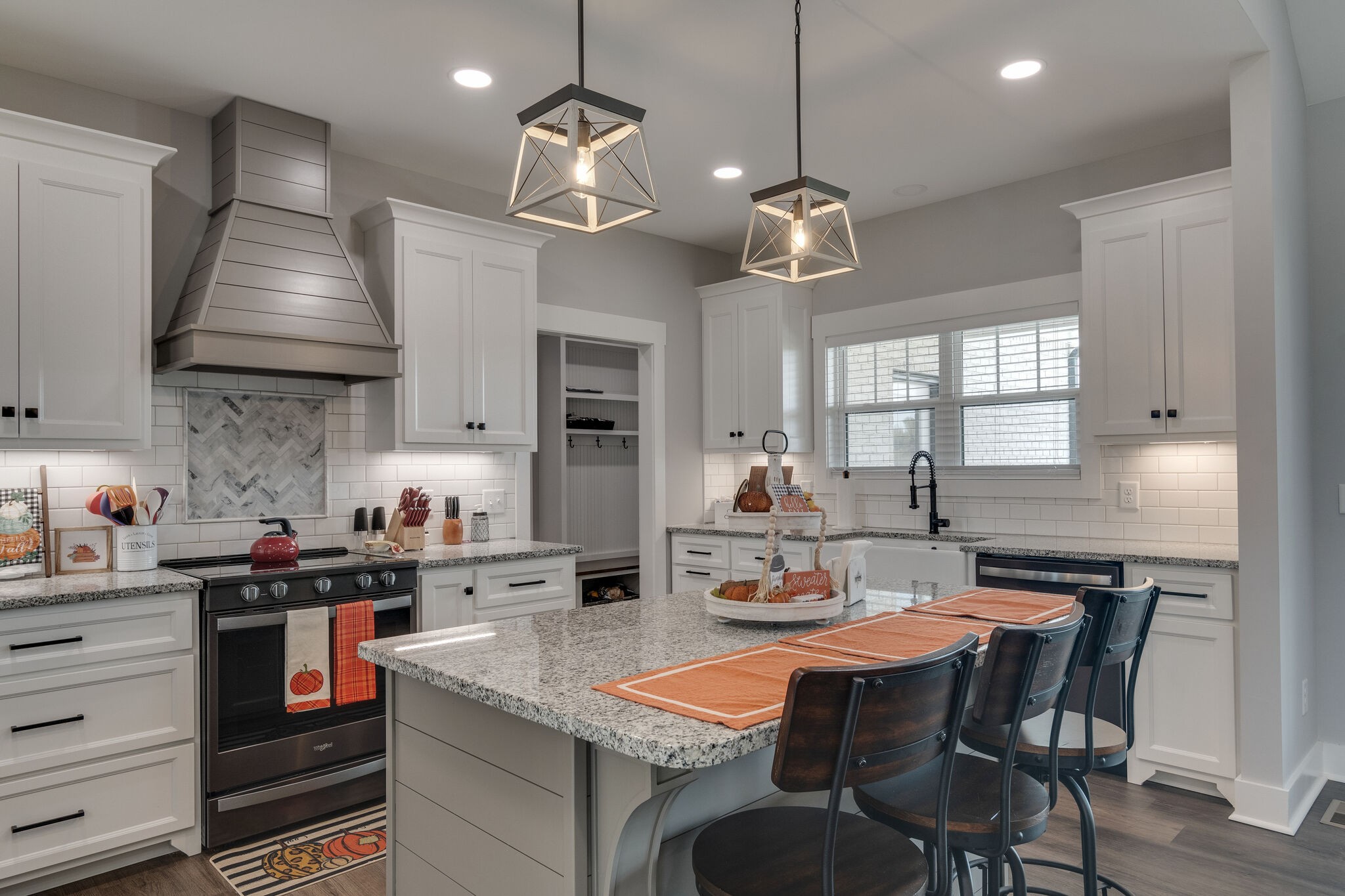 947 South Cross Bridges Road Mount Pleasant, TN 38474 - Photo 14 of 37 a kitchen with stainless steel appliances granite countertop a sink a stove and chairs