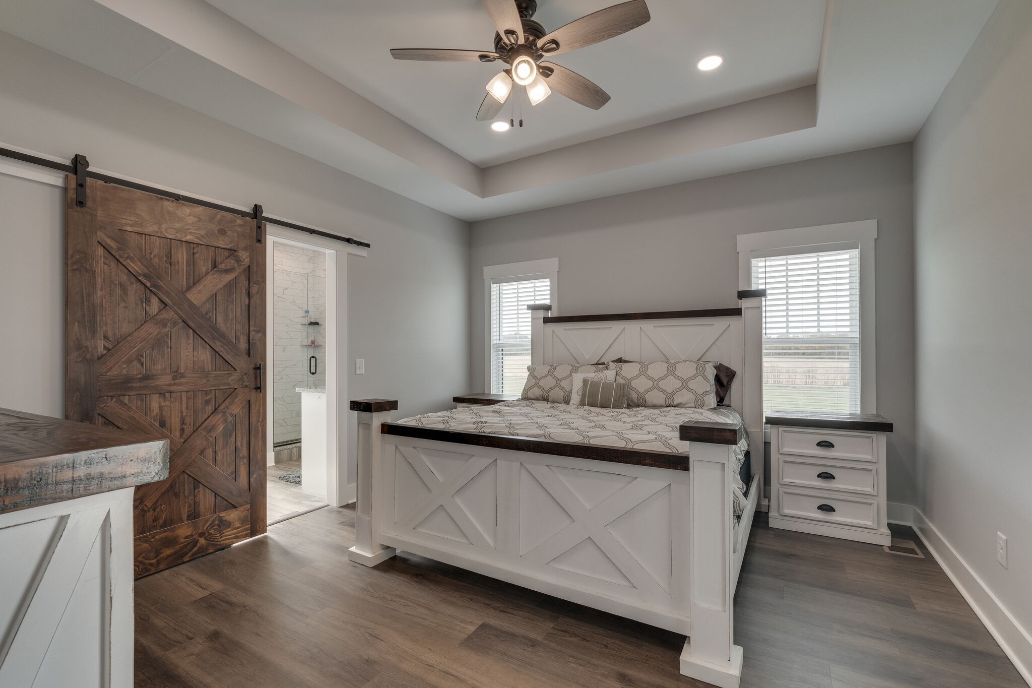 947 South Cross Bridges Road Mount Pleasant, TN 38474 - Photo 18 of 37 a bedroom with a bed and a chandelier