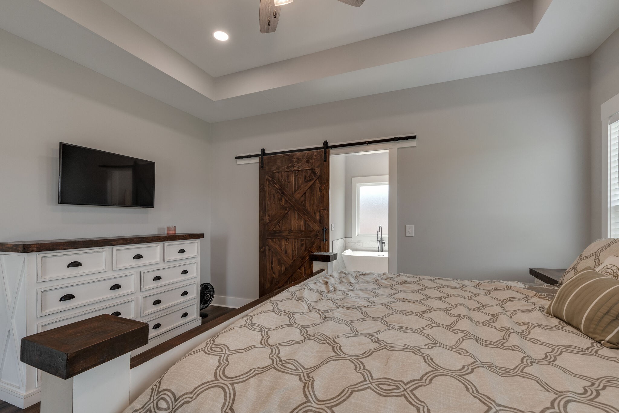 947 South Cross Bridges Road Mount Pleasant, TN 38474 - Photo 20 of 37 a bedroom with a bed and a flat tv screen on dresser