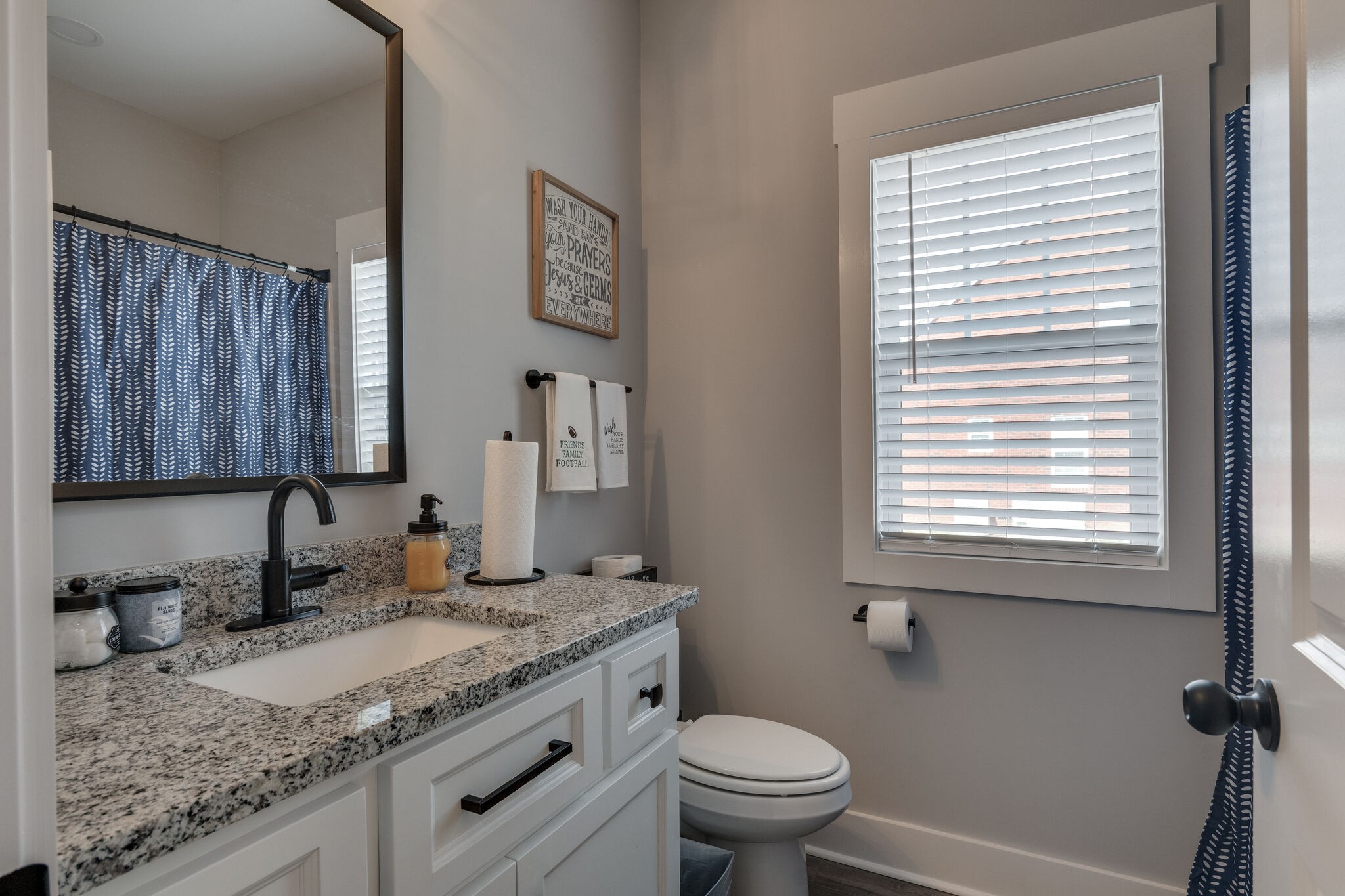 947 South Cross Bridges Road Mount Pleasant, TN 38474 - Photo 26 of 37 a bathroom with a granite countertop sink toilet and a mirror