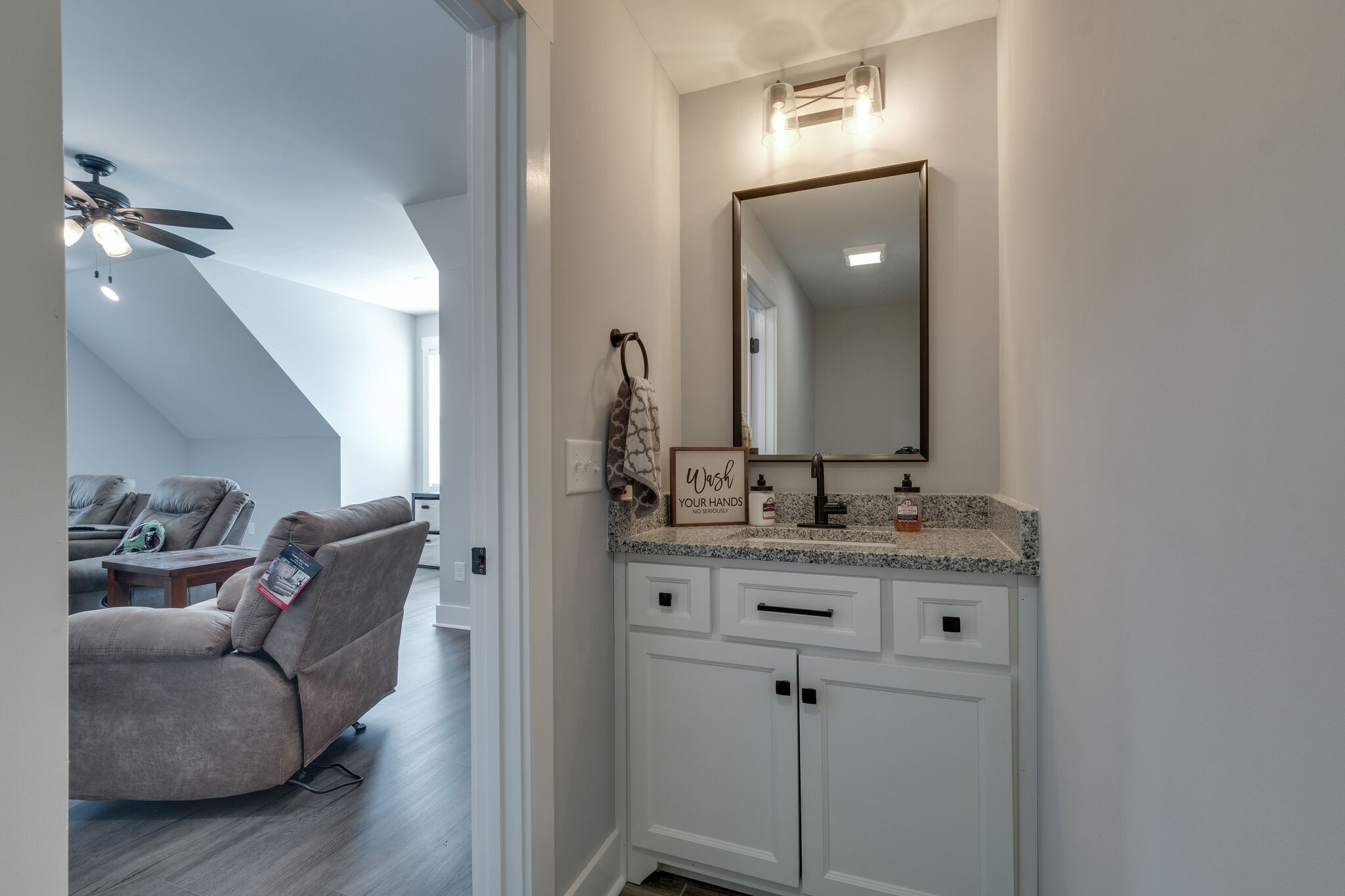947 South Cross Bridges Road Mount Pleasant, TN 38474 - Photo 31 of 37 a en suite bathroom with a granite countertop sink and a mirror