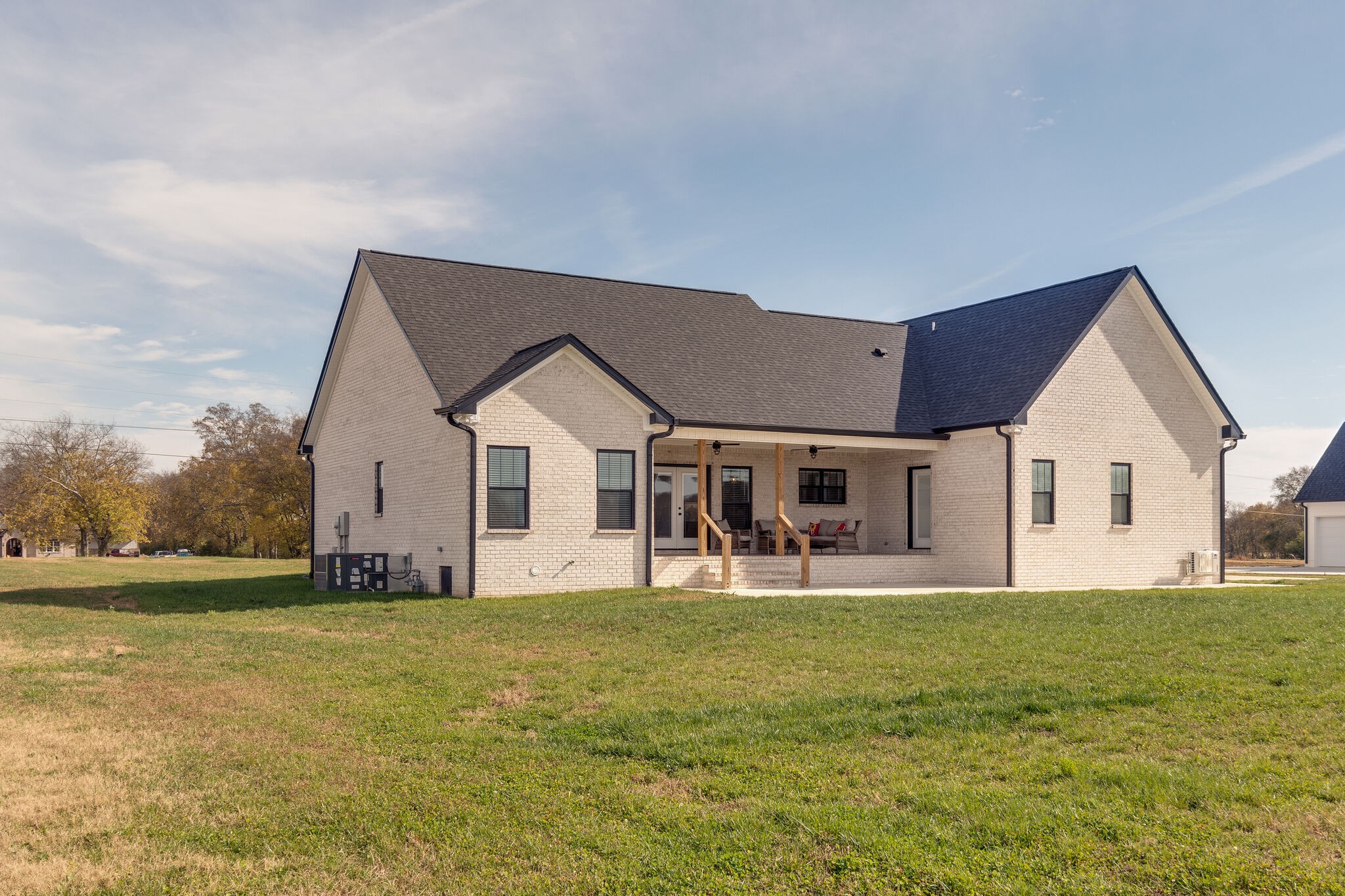 947 South Cross Bridges Road Mount Pleasant, TN 38474 - Photo 33 of 37 a front view of house with yard and trees in the background