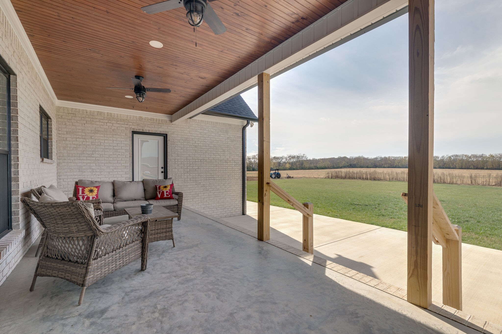 947 South Cross Bridges Road Mount Pleasant, TN 38474 - Photo 37 of 37 a living room with furniture and a floor to ceiling window