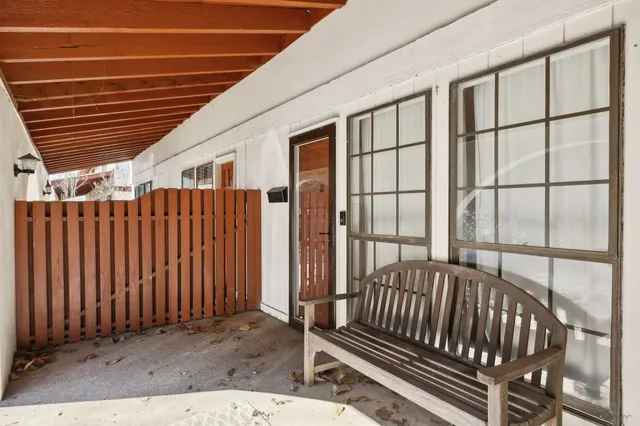 a view of a porch with wooden floor