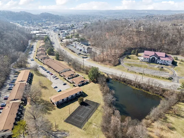 an aerial view of a house with a ocean view