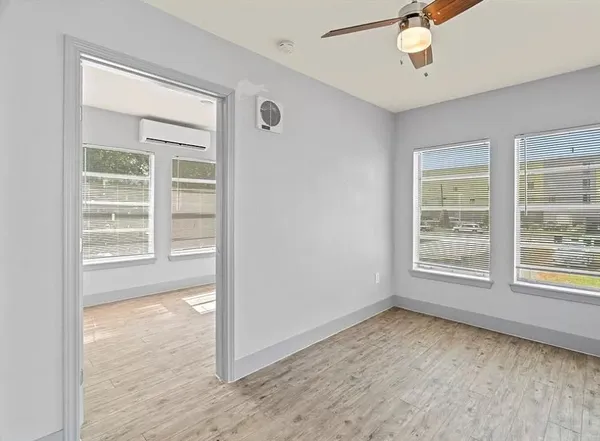 en empty room with windows and closet