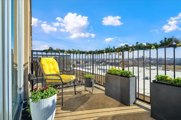 a view of a balcony with wooden floor
