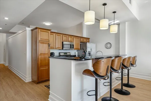 a kitchen with stainless steel appliances granite countertop a stove and a sink
