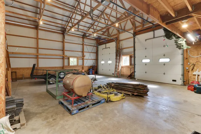 a view of hallway with a front door and wooden floor