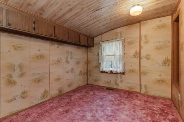 a view of a livingroom with furniture and window