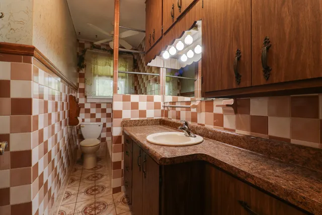 a view of a dining room with furniture and a chandelier