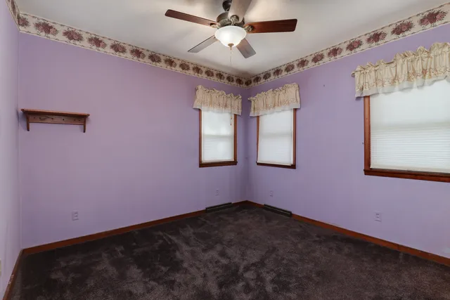 a bathroom with a shower a sink and a mirror