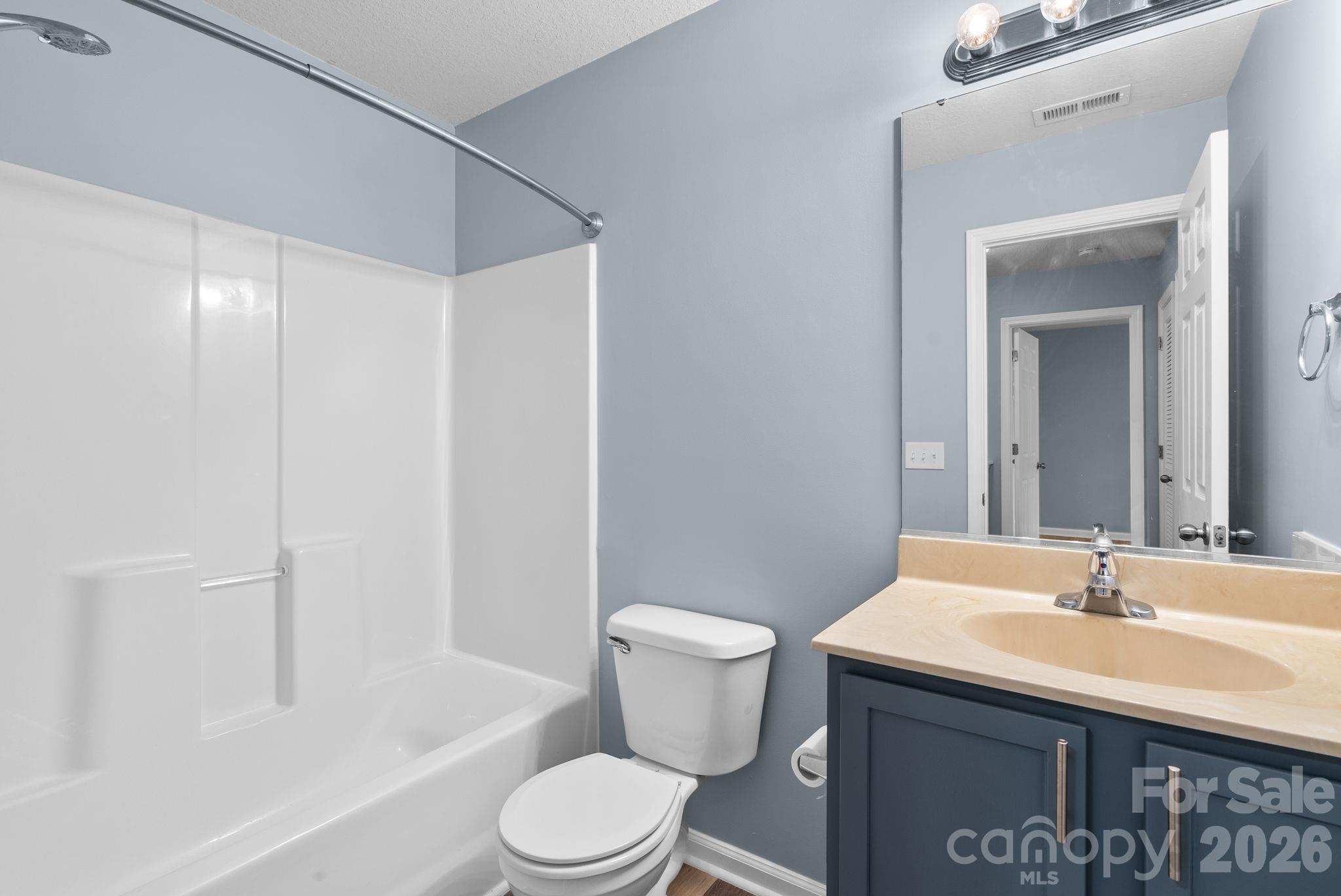 120 Alpine Ridge Drive Asheville, NC 28803 - Photo 24 of 28 a bathroom with a sink a toilet and shower