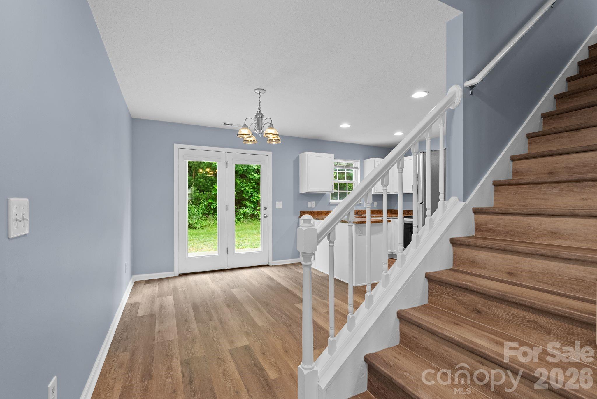 120 Alpine Ridge Drive Asheville, NC 28803 - Photo 5 of 28 a view of entryway and hall with wooden floor