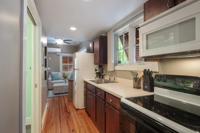 a kitchen with a sink stove and cabinets