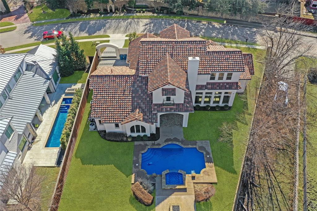 a aerial view of a house with swimming pool and furniture