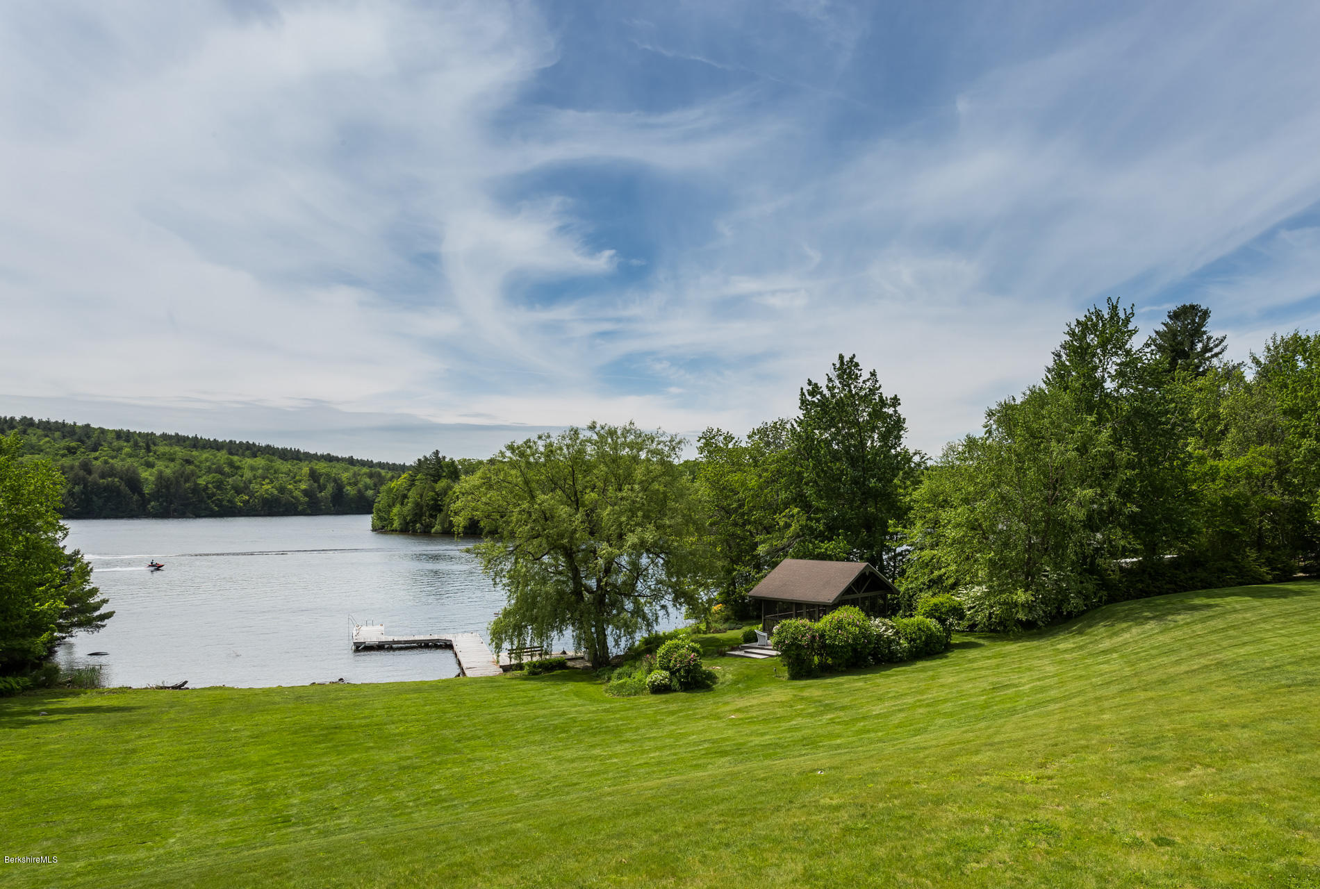 305 Moreau Road Tolland, MA 01034 - Photo 12 of 49 a view of a garden with a bench in the background