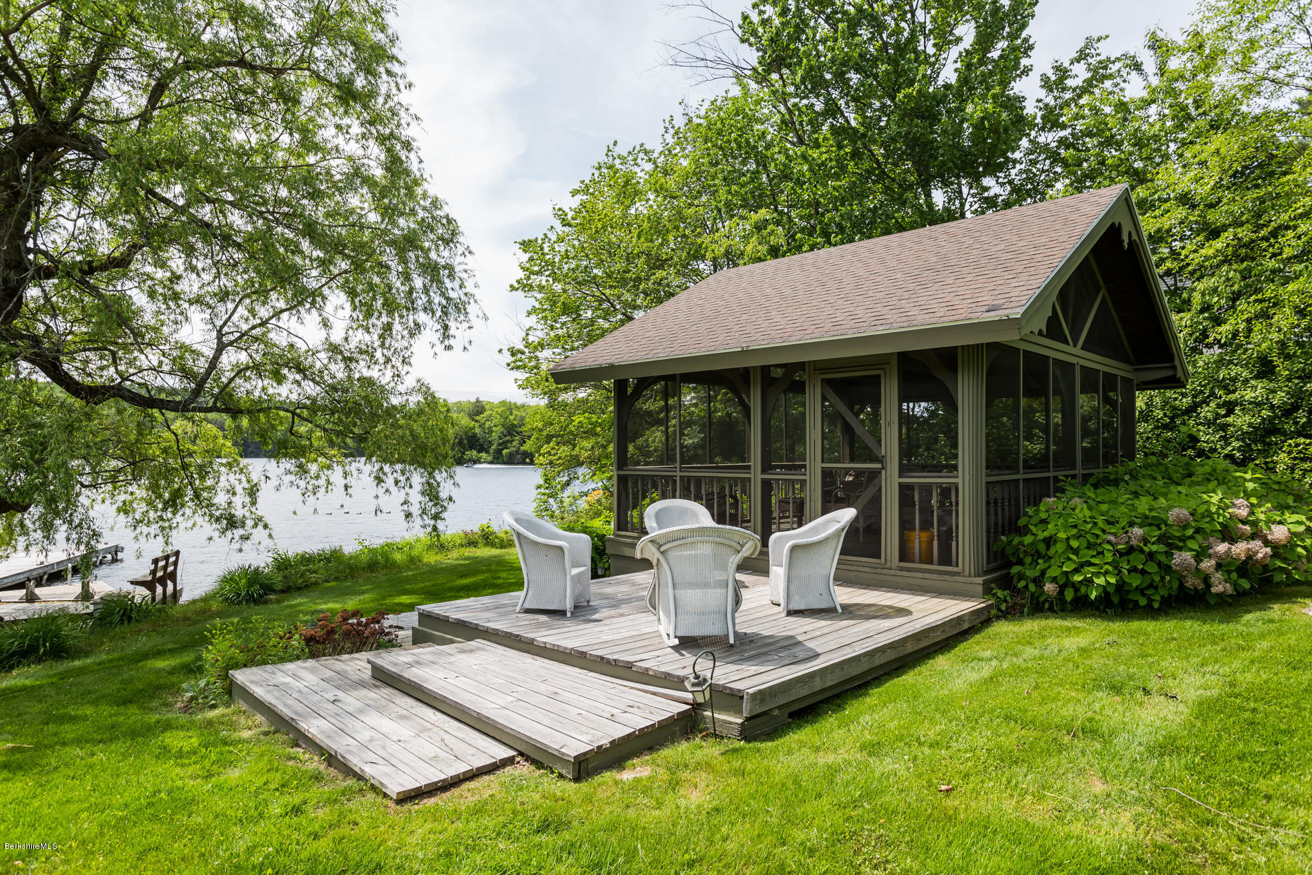 305 Moreau Road Tolland, MA 01034 - Photo 13 of 49 a view of backyard of house with a patio