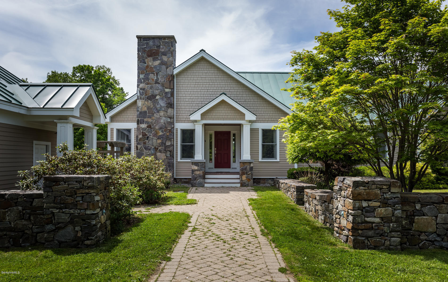 305 Moreau Road Tolland, MA 01034 - Photo 16 of 49 a front view of a house with garden