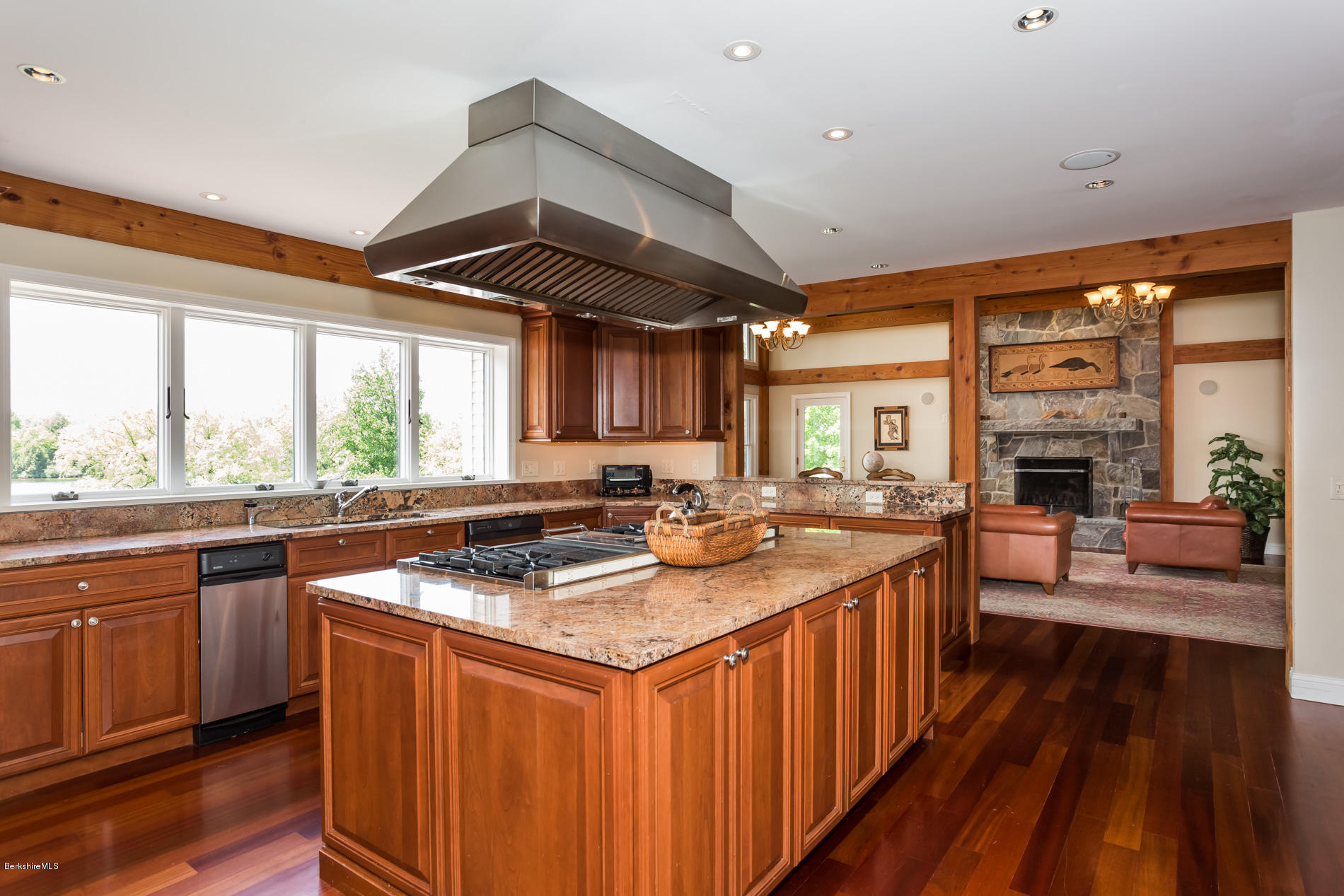 305 Moreau Road Tolland, MA 01034 - Photo 26 of 49 a kitchen with stainless steel appliances granite countertop a stove a sink dishwasher and a refrigerator with wooden floor