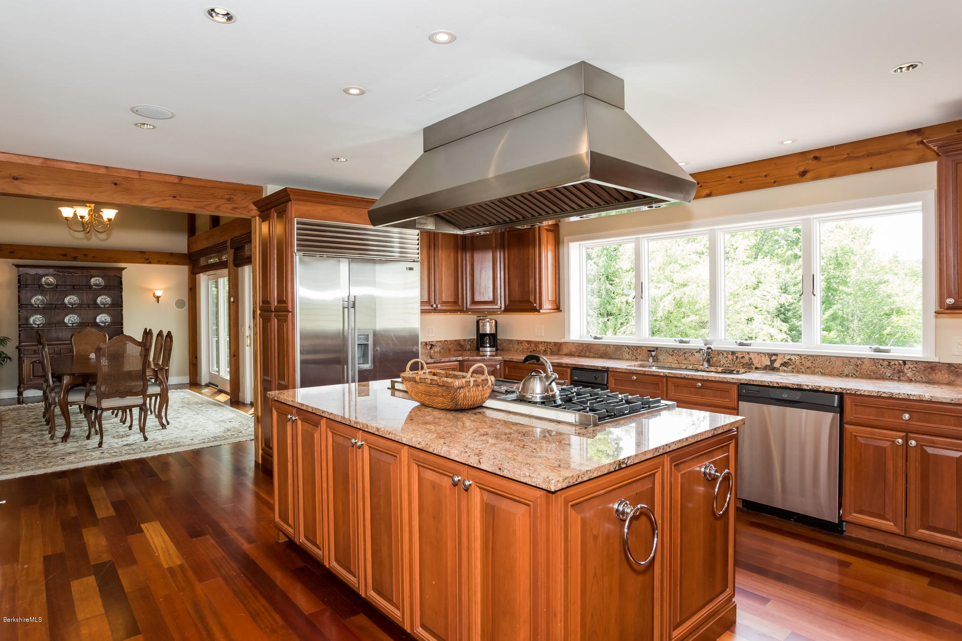 305 Moreau Road Tolland, MA 01034 - Photo 27 of 49 a kitchen with stainless steel appliances granite countertop a sink a stove and a wooden floors