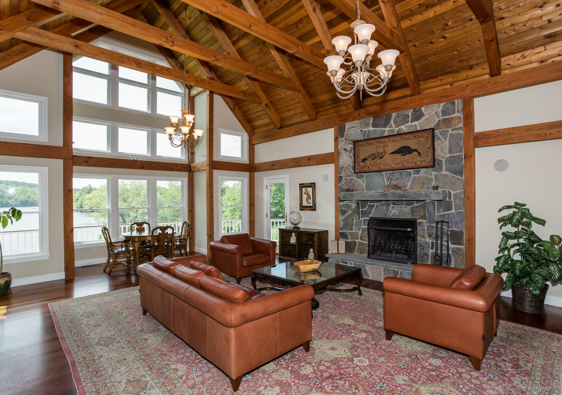305 Moreau Road Tolland, MA 01034 - Photo 30 of 49 a living room with furniture a fireplace and a large window