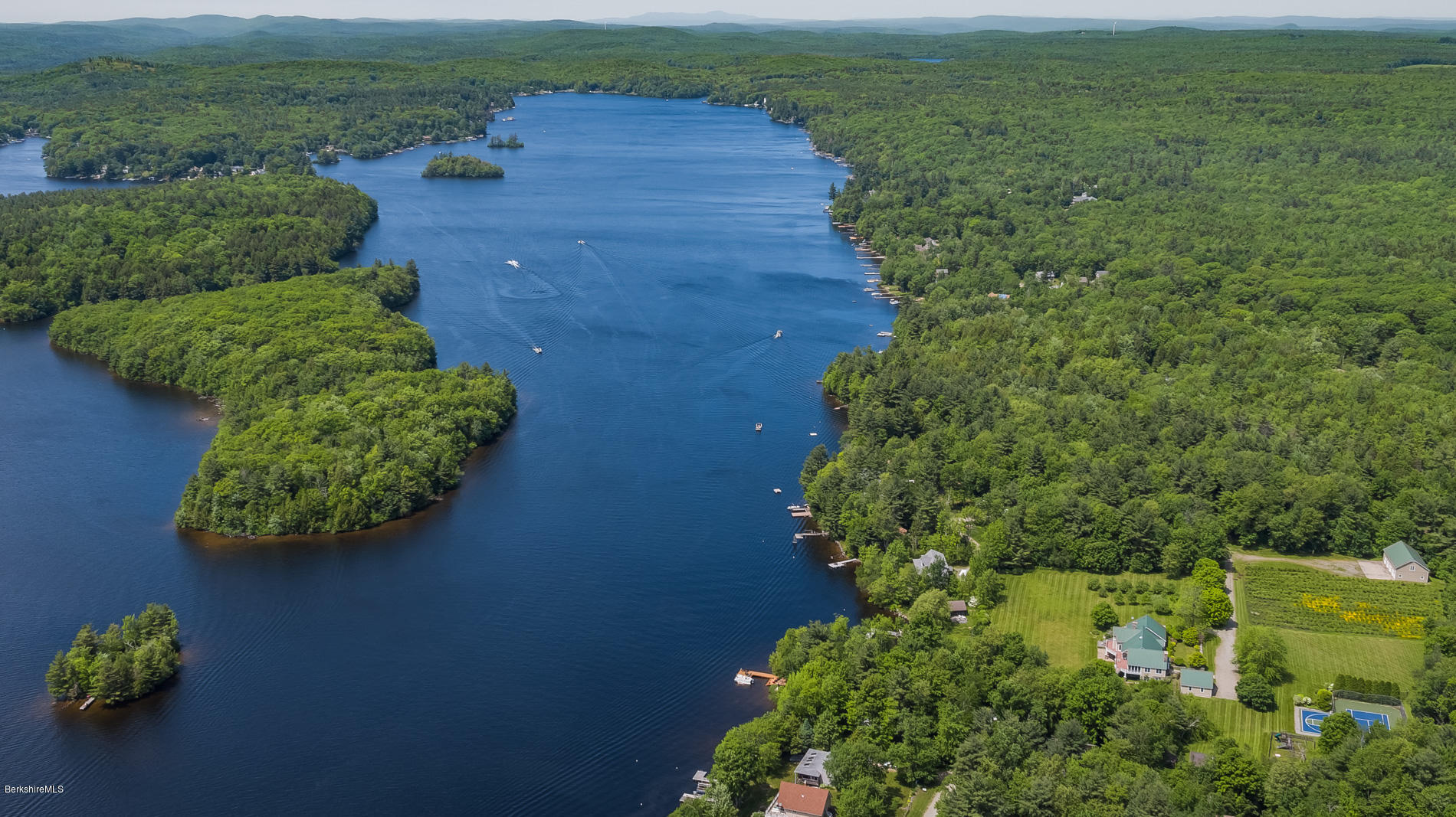 305 Moreau Road Tolland, MA 01034 - Photo 4 of 49 a view of a garden with lawn chairs