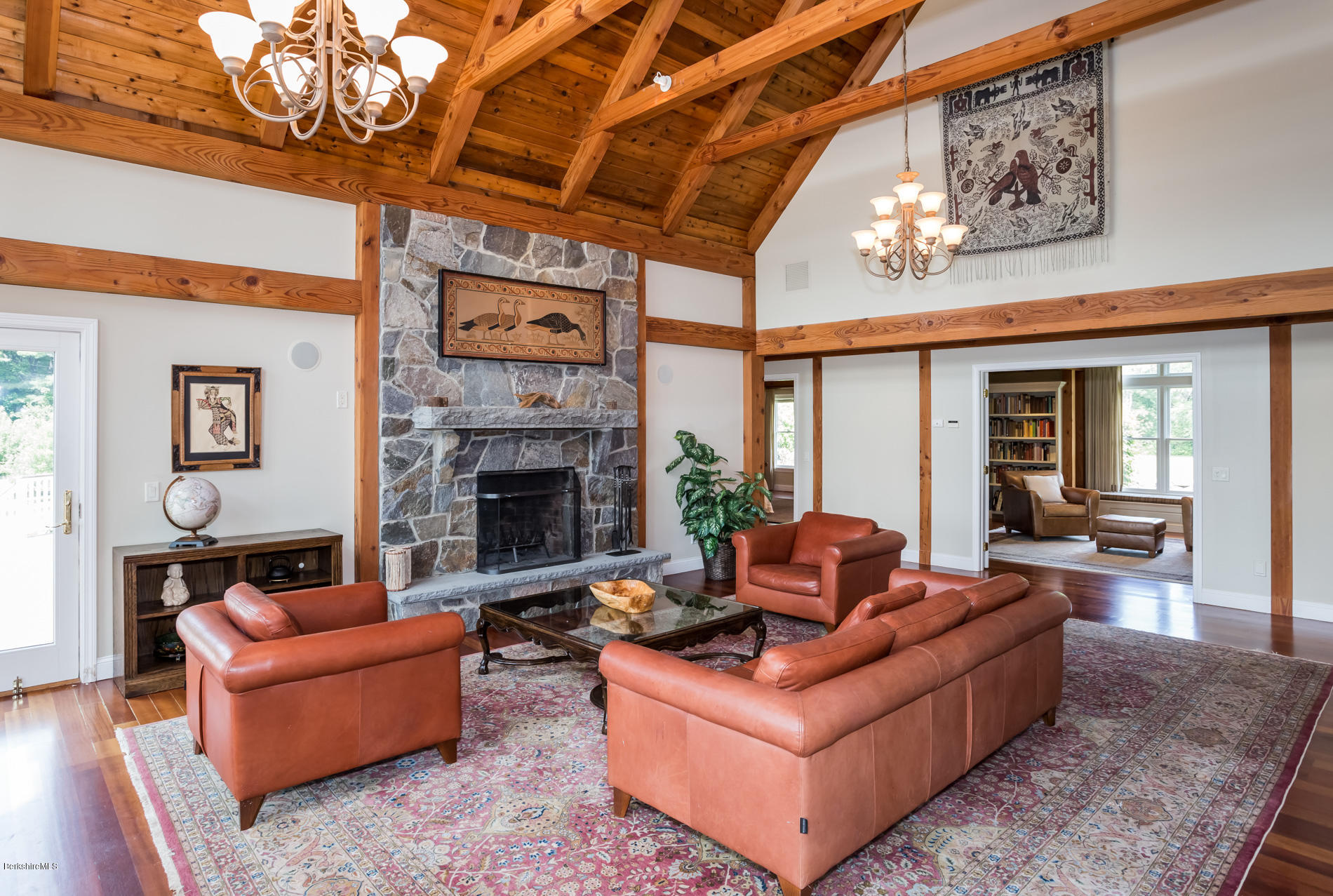 305 Moreau Road Tolland, MA 01034 - Photo 33 of 49 a living room with furniture a table and a fireplace