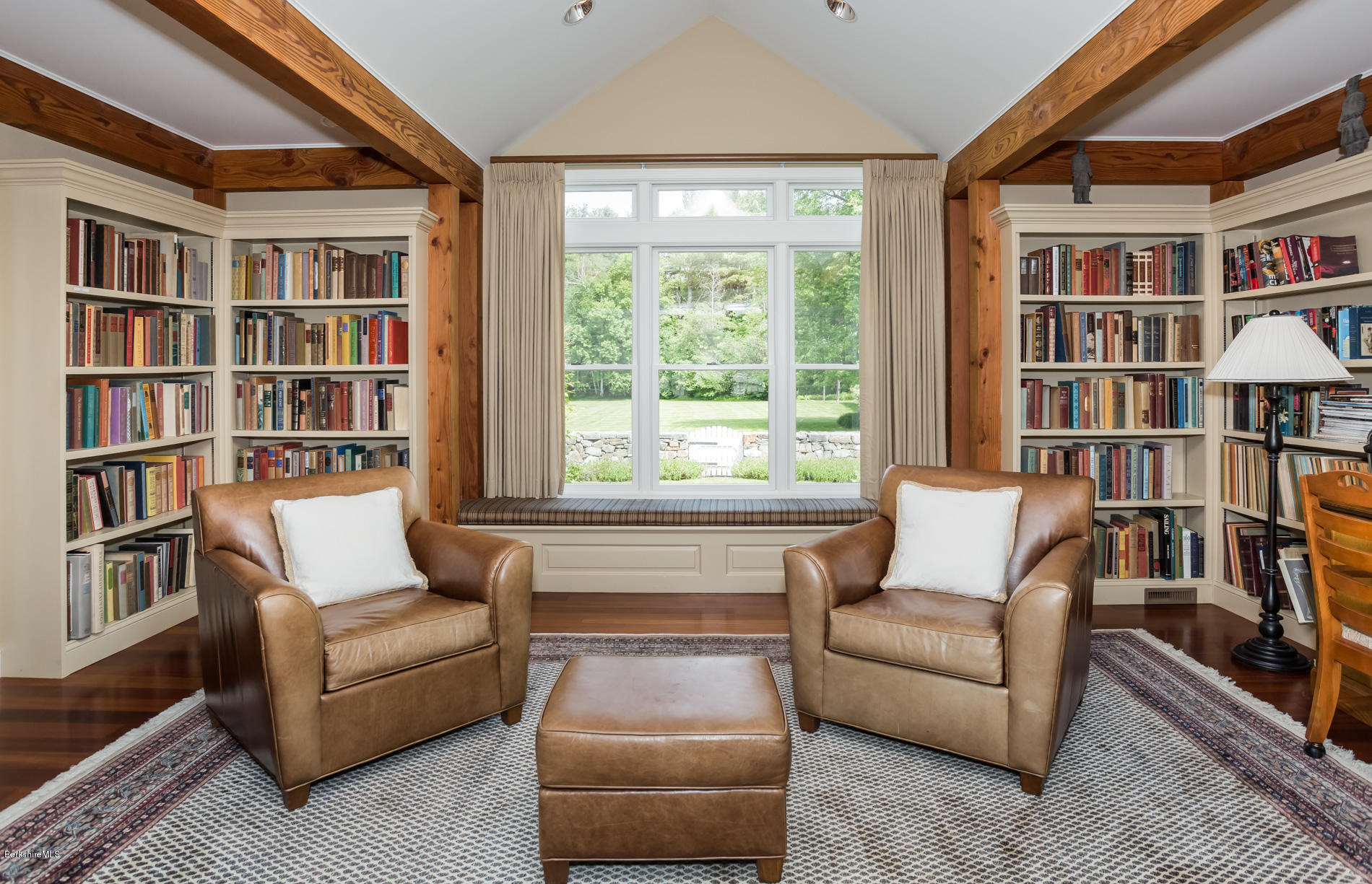 305 Moreau Road Tolland, MA 01034 - Photo 34 of 49 a living room with furniture and a book shelf