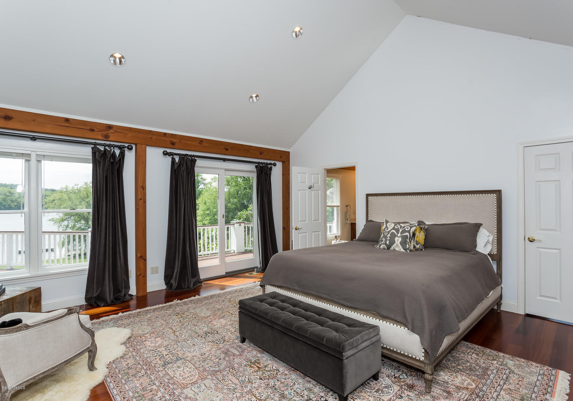 305 Moreau Road Tolland, MA 01034 - Photo 35 of 49 a bedroom with a large bed and a large window