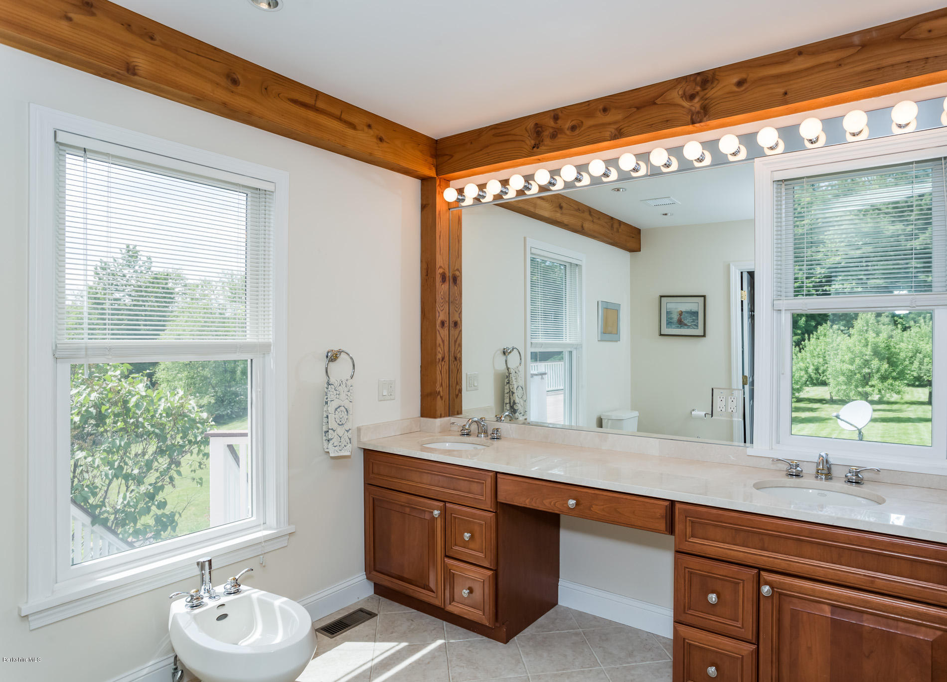 305 Moreau Road Tolland, MA 01034 - Photo 36 of 49 a spacious bathroom with a granite countertop sink mirror and a window
