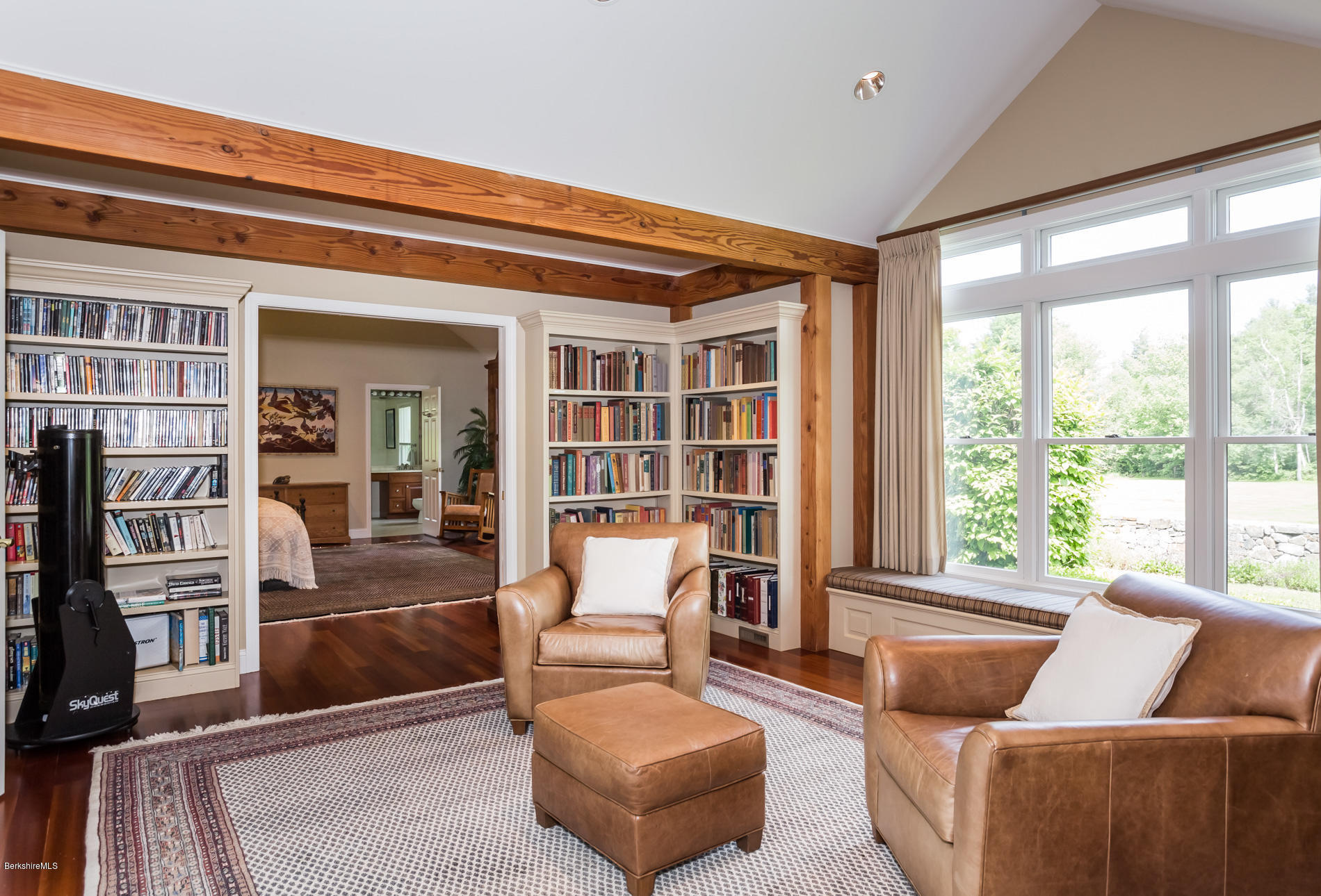 305 Moreau Road Tolland, MA 01034 - Photo 40 of 49 a living room with furniture and a floor to ceiling window