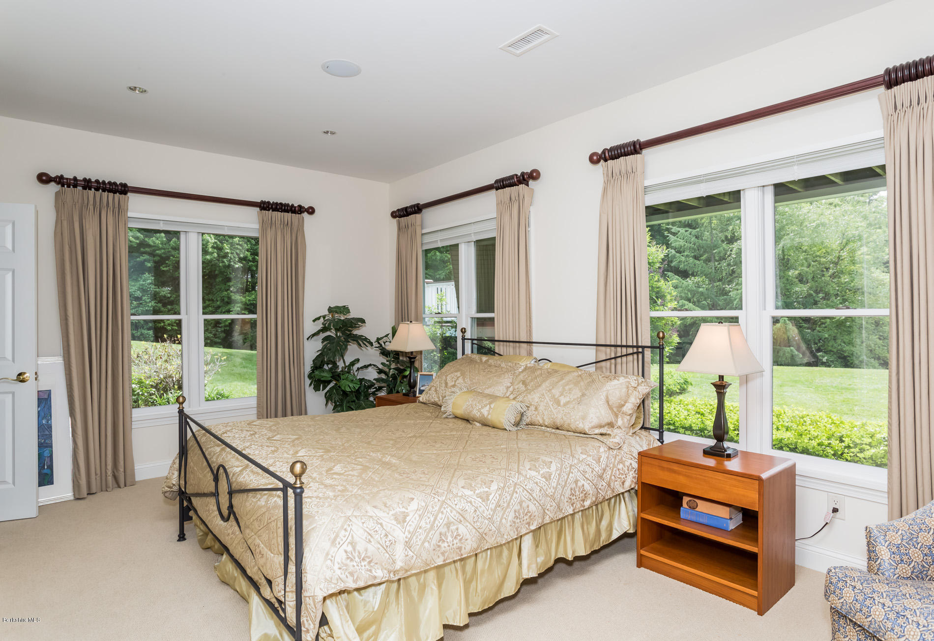 305 Moreau Road Tolland, MA 01034 - Photo 42 of 49 a bed sitting in a bedroom next to a window