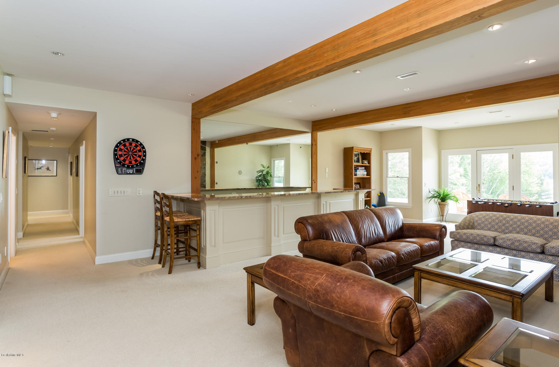 305 Moreau Road Tolland, MA 01034 - Photo 44 of 49 a living room with furniture and a flat screen tv