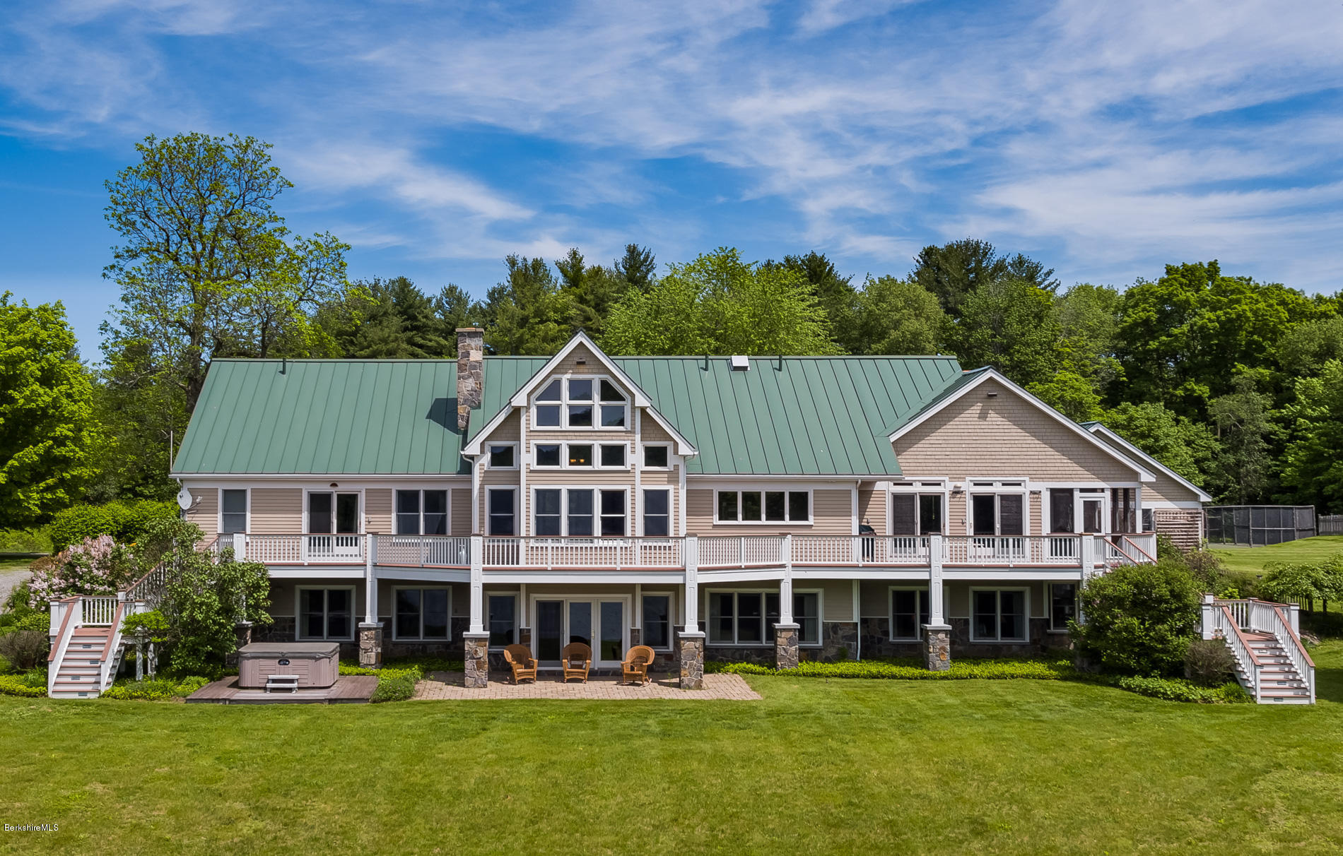 305 Moreau Road Tolland, MA 01034 - Photo 6 of 49 a front view of a house with a garden and plants