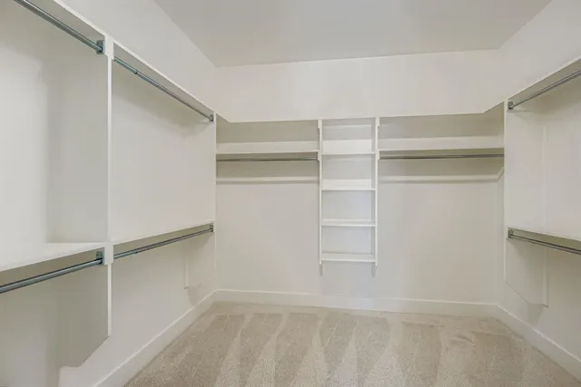 a view of an empty walk in closet
