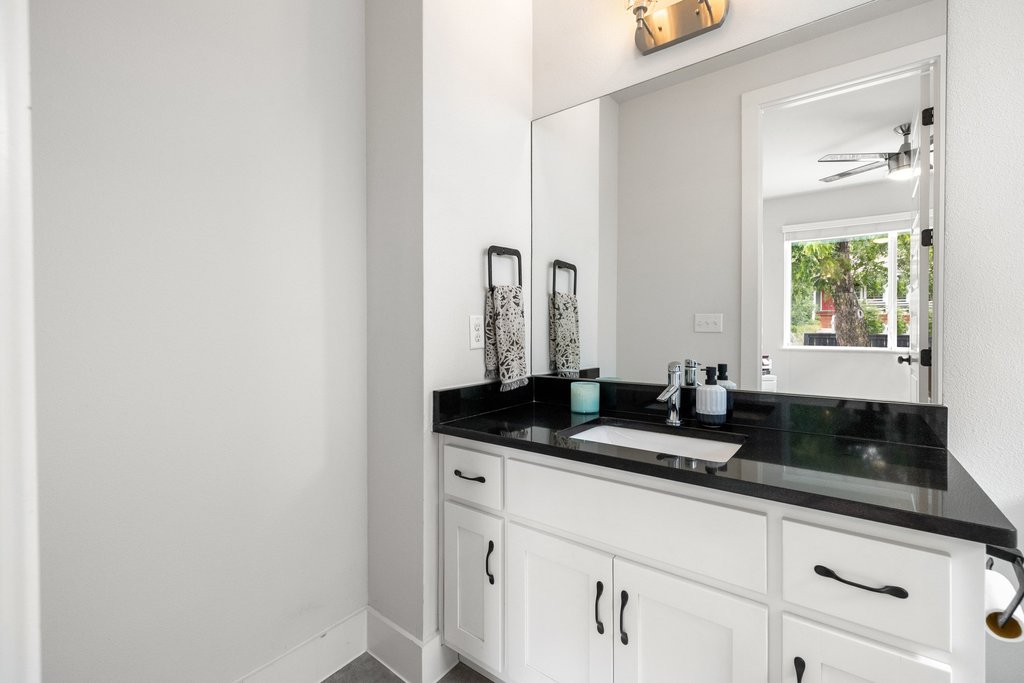 1182 Ridgeway Drive, Unit A Austin, TX 78702 - Photo 27 of 35 a close view of sink and mirror