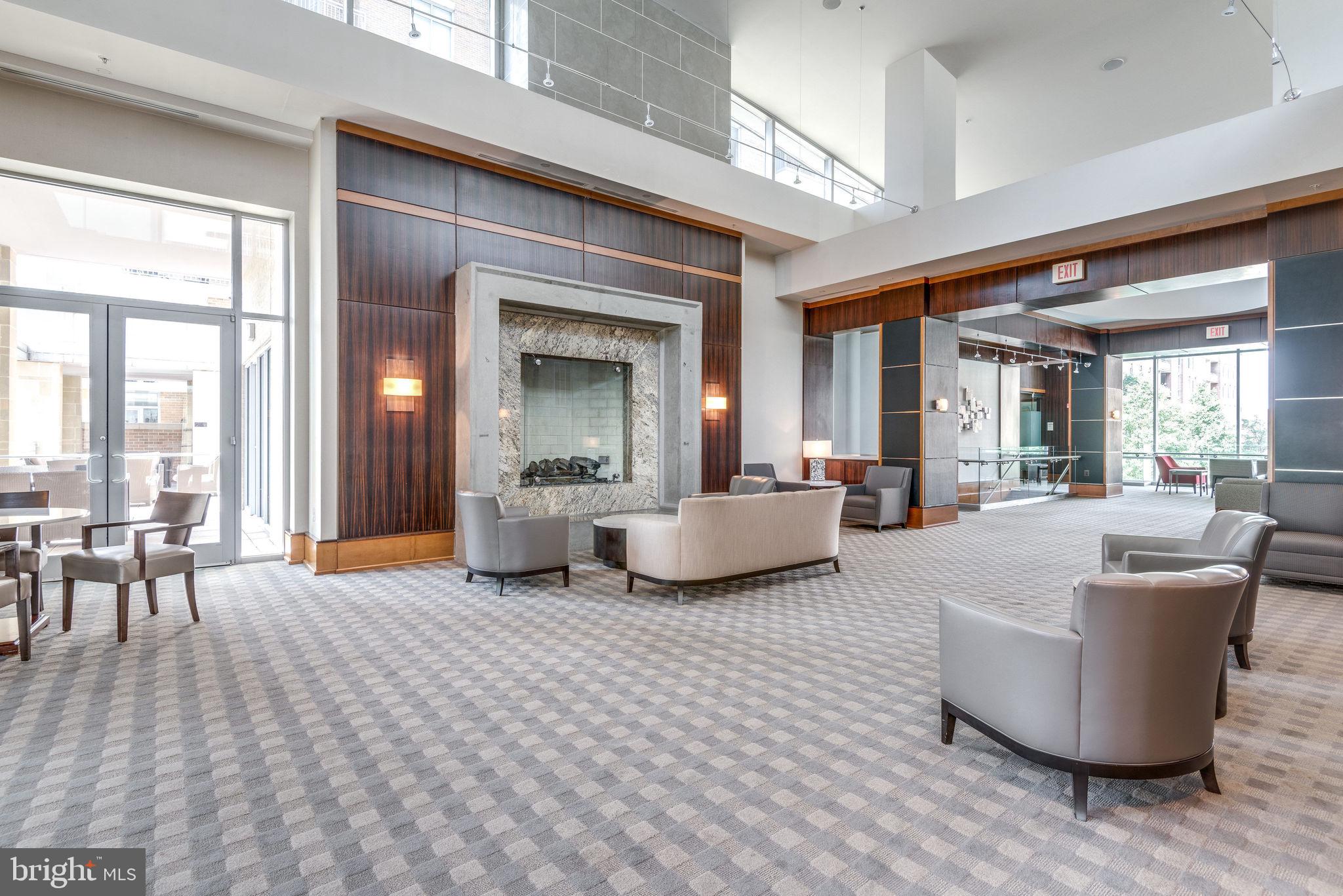 11990 Market Street, Unit 401 Reston, VA 20190 - Photo 47 of 85 Enjoy a coffee or book in front of the fireplace
