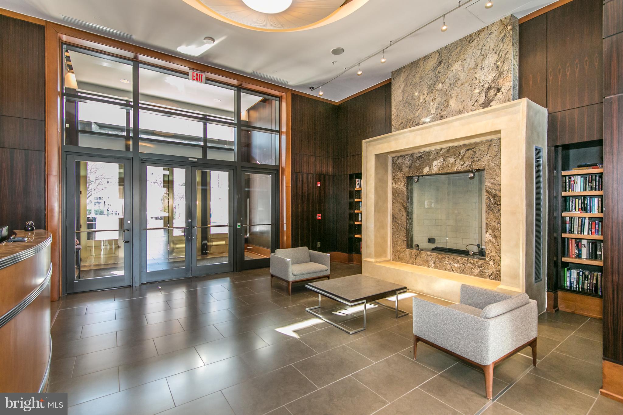 11990 Market Street, Unit 401 Reston, VA 20190 - Photo 53 of 85 Elegant lobby with gas fireplace