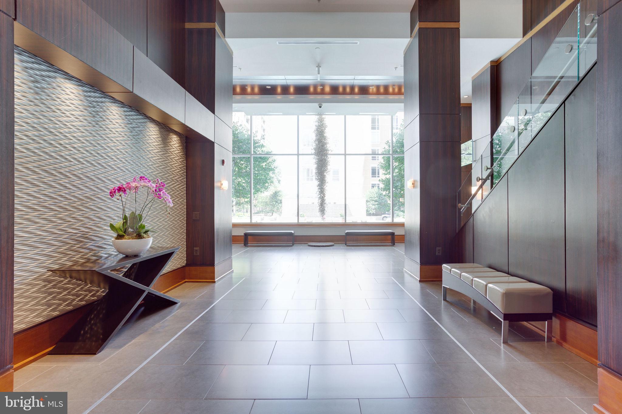 11990 Market Street, Unit 401 Reston, VA 20190 - Photo 54 of 85 Midtown lobby overlooking pool deck