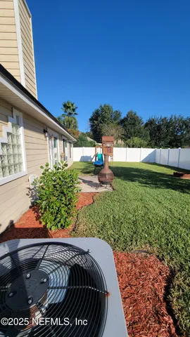 a view of a backyard with a garden and plants