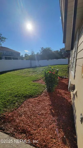 a view of a yard with an outdoor space