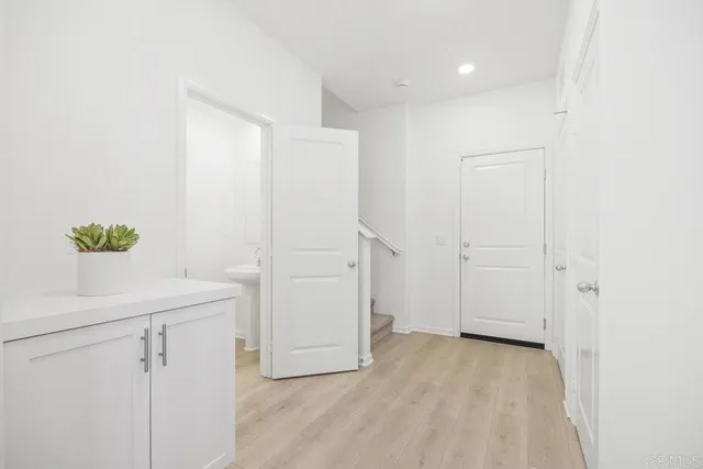 a view of a room with wooden floor