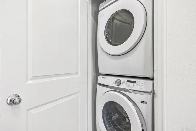 a front view of a house with a garden and plants