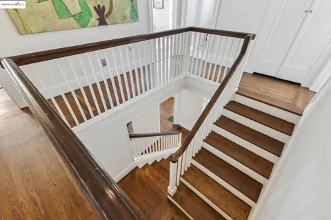 a view of a patio with couches table and chairs and potted plants