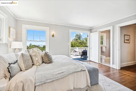 a view of a chair and tables in the balcony
