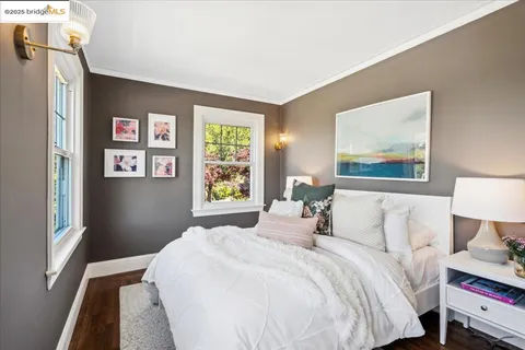 a bathroom with a toilet a sink and a window